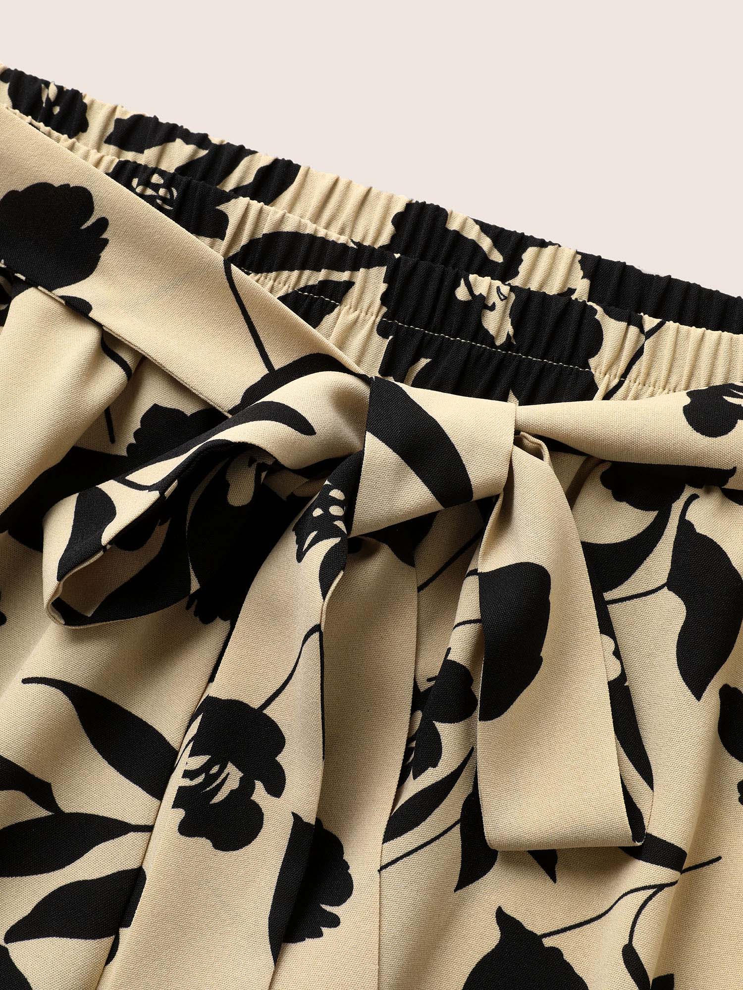 Silhouette broek met bloemenprint en stropdassen in zijnaden