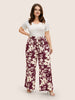 Silhouette broek met bloemenprint en stropdassen in zijnaden